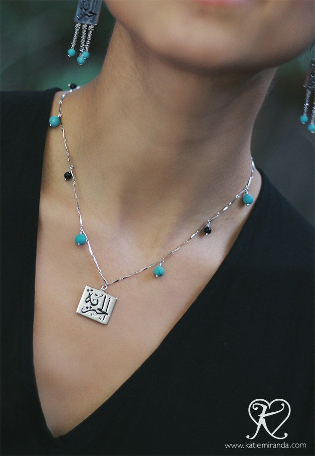 Freedom “huriyyeh” Arabic Calligraphy Necklace - Turquoise worn